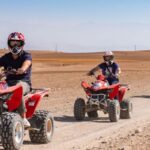 Group of travelers riding quad bikes in Agafay Desert