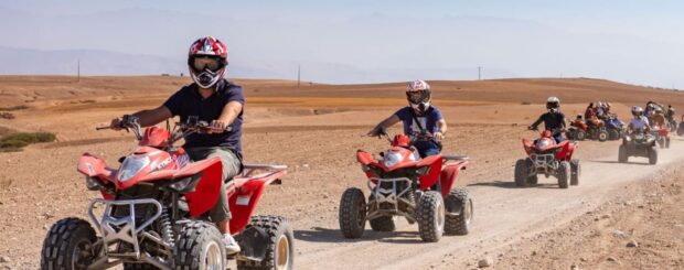 Group of travelers riding quad bikes in Agafay Desert