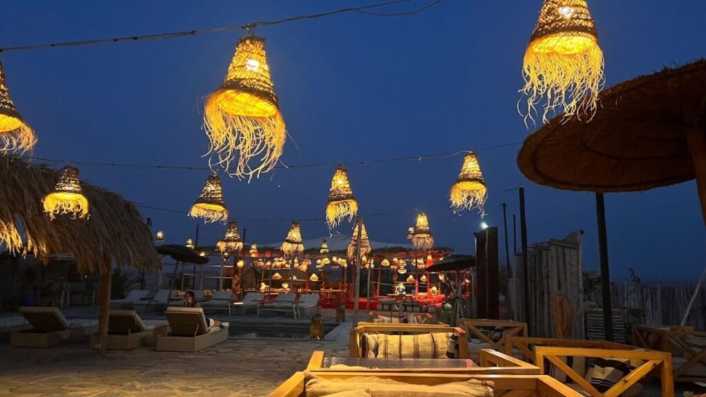 Agafay dinner camp at night with traditional Moroccan ambiance and illuminated tents