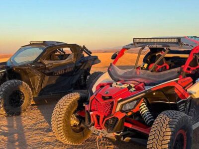 Group of travelers on a guided buggy excursion across the Agafay Desert near Marrakech, Morocco.