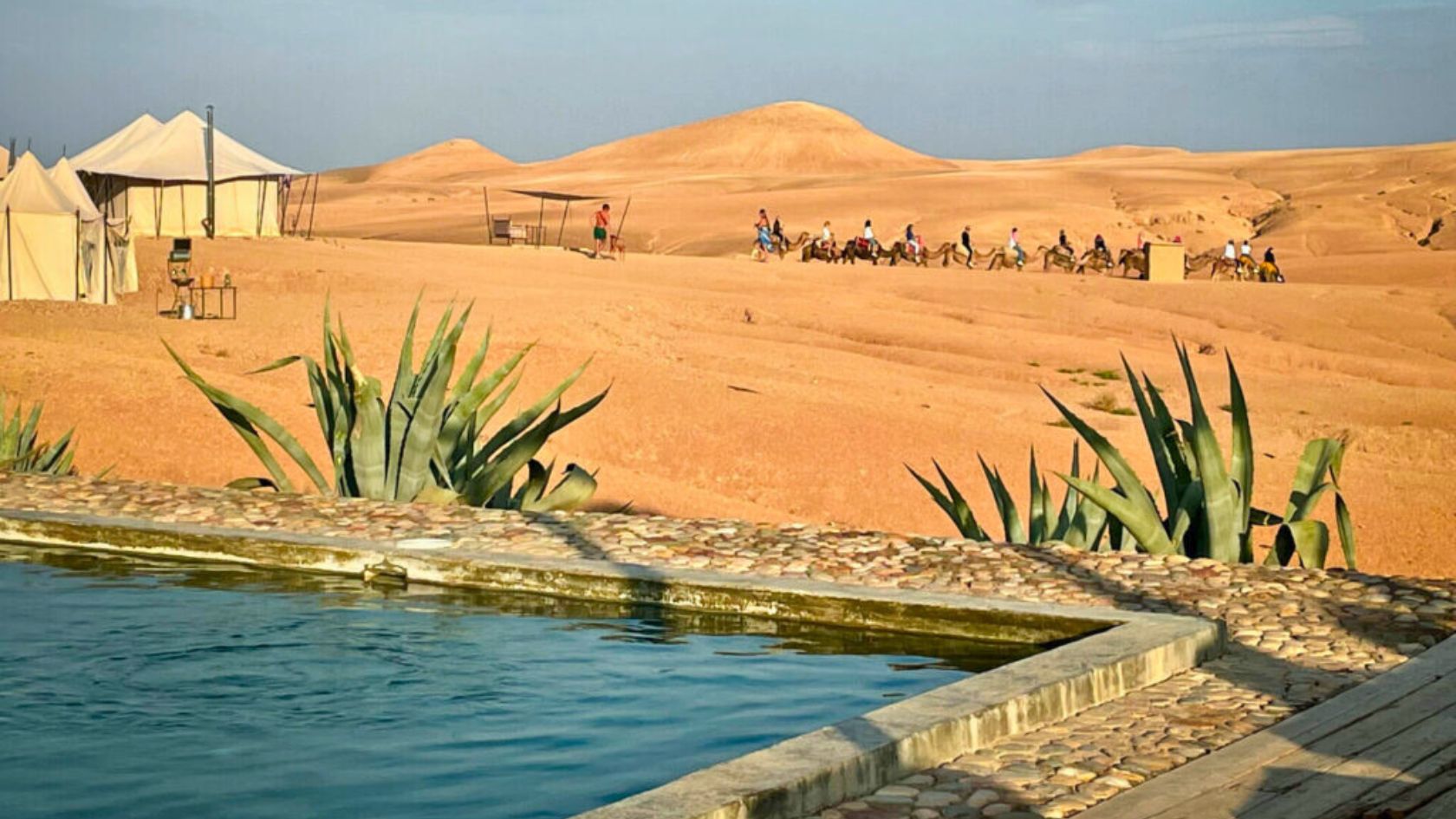 Luxury desert camp with swimming pool in the Agafay Desert near Marrakech, Morocco.