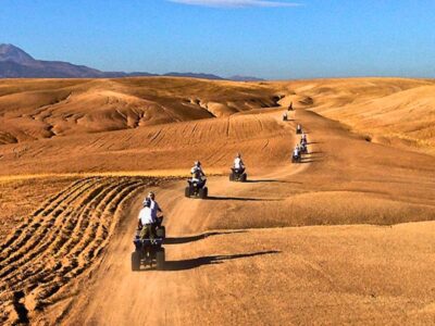 Group of travelers enjoying a quad biking adventure across the Agafay Desert near Marrakech.